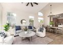 Bright living room featuring modern furniture, high ceilings, and an open floor plan with lots of natural light at 5426 E Karen Dr, Scottsdale, AZ 85254