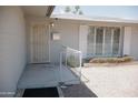 Charming single-story home with a decorative door, stylish shutters, and manicured gravel yard at 5602 W Heatherbrae Dr, Phoenix, AZ 85031