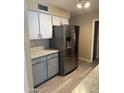 Updated kitchen featuring stainless steel refrigerator and plenty of storage space at 6048 E Des Moines St, Mesa, AZ 85205