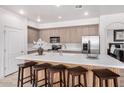 Spacious kitchen featuring stainless steel appliances and a large center island at 705 W Queen Creek Rd # 2062, Chandler, AZ 85248