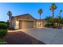 Charming home with a three-car garage, well-maintained landscaping, and warm exterior lighting at 786 E Coconino Dr, Chandler, AZ 85249