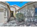 Inviting walkway leads to the front door, accentuated by desert landscaping and exterior lighting at 11580 N 86Th Ln, Peoria, AZ 85345