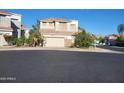 Inviting two-story home with a two-car garage and a well-maintained yard with desert landscaping at 1257 E Voltaire Ave, Phoenix, AZ 85022