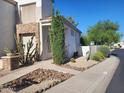 Inviting home with beautiful desert landscaping, rock beds, walkway, and stylish shutters at 1257 E Voltaire Ave, Phoenix, AZ 85022