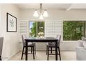 Bright dining area with a modern chandelier and seating for four at 14000 N 94Th St # 2187, Scottsdale, AZ 85260
