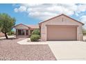 Beautiful single-story home with a two-car garage and desert landscaping for low maintenance at 20234 N Mariposa Way, Surprise, AZ 85374