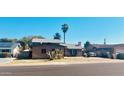 Quaint single-Gathering home with desert landscaping on a sunny day under a vibrant blue sky at 4316 W Rose Ln, Glendale, AZ 85301