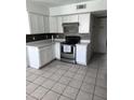 Well-lit kitchen with stainless steel appliances and ample cabinet space at 4316 W Rose Ln, Glendale, AZ 85301