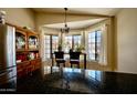 Bright breakfast nook featuring hardwood floors, pendant lighting, and lots of natural light at 4527 E Amberwood Dr, Phoenix, AZ 85048