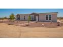 Charming single-Gathering home with rock landscaping and a walkway leading to the front door at 873 N Windy Meadow Ln, Maricopa, AZ 85139