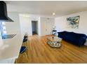 Bright, open-concept living area with hardwood floors and designer finishes at 9053 N 53Rd Ave, Glendale, AZ 85302