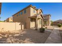 Charming two-story home with low-maintenance desert landscaping at 909 E Agua Fria Ln, Avondale, AZ 85323