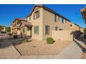 Beautiful two-story home featuring desert landscaping and a side yard at 909 E Agua Fria Ln, Avondale, AZ 85323