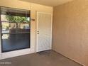 Inviting front entrance showcasing a secure door and pleasant view through a window at 1340 N Recker Rd # 154, Mesa, AZ 85205
