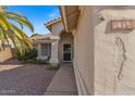 Close up view of the front door and address number in a desert landscaped front yard at 1415 W Michigan Ave, Phoenix, AZ 85023