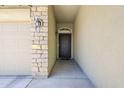Exterior shot of the front door with decorative iron work and a covered entryway at 2717 W Bowker St, Phoenix, AZ 85041