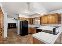 Functional kitchen featuring tile countertops and modern appliances at 414 E Westchester Dr, Tempe, AZ 85283