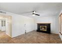 Inviting living room features tile flooring and cozy fireplace at 414 E Westchester Dr, Tempe, AZ 85283