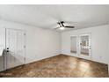 Spacious living room features tile flooring and access to the patio at 414 E Westchester Dr, Tempe, AZ 85283