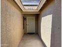 Inviting entryway featuring a decorative security door, neutral stucco walls, and covered porch at 45726 W Long Way, Maricopa, AZ 85139