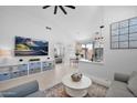 A bright and airy open floor plan that connects the living room to the dining and kitchen areas at 9918 E Escondido Ave, Mesa, AZ 85208