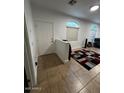 Bright entryway featuring tile floors, a staircase, and natural light from multiple windows at 1350 S Greenfield Rd # 1219, Mesa, AZ 85206
