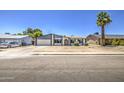 Inviting single-story home with an attached garage, an arched entry way, and a well-kept yard at 14014 N 39Th Ave, Phoenix, AZ 85053