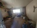 Cozy living room with a fireplace and large window allowing plenty of natural light at 14214 N 36Th Ave, Phoenix, AZ 85053