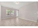Inviting living room with neutral paint, tile flooring, and natural light at 2000 N 36Th St # 30, Phoenix, AZ 85008