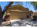 Exterior photo showing a two-car garage attached to the front of a single Gathering home at 23682 W Bowker St, Buckeye, AZ 85326