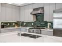 The kitchen boasts modern fixtures, stainless steel appliances, and stylish backsplash at 240 W Missouri Ave # 1, Phoenix, AZ 85013