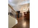 Open dining area with bar and new wood-look flooring at 11210 W Alvarado Rd, Avondale, AZ 85392