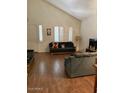 Inviting living room with hardwood floors and plantation shutters at 11210 W Alvarado Rd, Avondale, AZ 85392