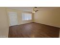 Bright living room with luxury vinyl plank flooring, updated fixtures, and a large window at 1414 W Monona Dr, Phoenix, AZ 85027