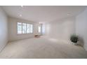 Bright and airy living room with neutral carpeting, complemented by natural light from the window at 1844 W Virginia Ave, Phoenix, AZ 85007