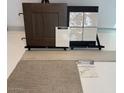 Interior finish samples displayed including, wood floor, wood door, off white carpet, tile, and counter samples at 18751 W Monterosa St, Litchfield Park, AZ 85340
