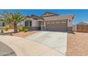 Charming single-story home with stone accents, desert landscaping, and an attached two-car garage at 40913 W Williams Way, Maricopa, AZ 85138