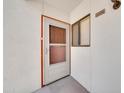 Exterior shot of the front door and the condo number with a small window at 750 E Northern Ave # 2006, Phoenix, AZ 85020