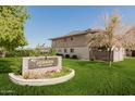 Sign for Judson complex with lush green grass and well maintained landscaping at 8211 E Garfield St # J219, Scottsdale, AZ 85257