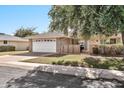 Inviting single-story home featuring a well-kept lawn and a brick facade near the entry at 10205 W Royal Oak Rd, Sun City, AZ 85351