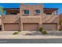 View of the townhouses with attached garages and a nice exterior design with balconies at 13600 N Fountain Hills Blvd # 501, Fountain Hills, AZ 85268