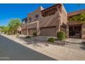 View of beautiful townhouses featuring attached garages, landscaped grounds and balconies at 13600 N Fountain Hills Blvd # 501, Fountain Hills, AZ 85268