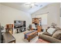 Cozy bedroom with vaulted ceilings, neutral walls and comfortable furniture at 16136 W Durango St, Goodyear, AZ 85338
