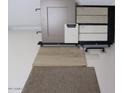 Selection of interior design elements including wood flooring, carpet, cabinet door, and countertop samples at 18747 W Monterosa St, Litchfield Park, AZ 85340