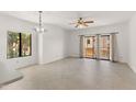 A bright, open living room space with balcony access and natural light at 19400 N Westbrook Pkwy # 220, Peoria, AZ 85382