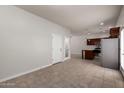 Spacious living room featuring tile floors and an open layout to the kitchen at 2000 N 36Th St # 10, Phoenix, AZ 85008