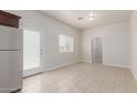 Bright and airy kitchen area with stainless steel refrigerator and access to the back yard at 2000 N 36Th St # 41, Phoenix, AZ 85008