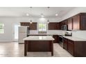 Modern kitchen featuring stainless steel appliances, a large island, and stylish cabinetry at 2000 N 36Th St # 8, Phoenix, AZ 85008