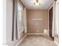 Bright entryway with tile flooring, coat hooks, and natural light at 2062 W Roy Rogers Rd, Phoenix, AZ 85085