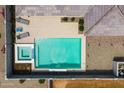 Aerial view of backyard featuring a sparkling pool, a spa, and a lounging area at 22657 N 184Th Ln, Surprise, AZ 85387